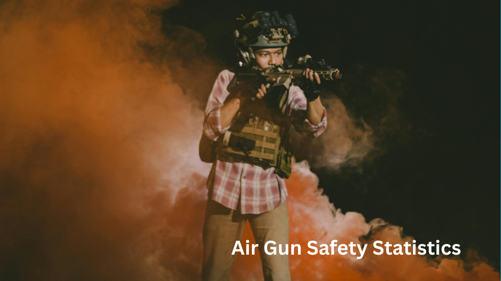 Individual wearing protective gear demonstrating controlled air gun handling in a training environment.