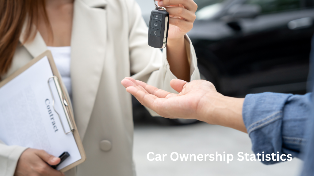 Person handing over car keys while holding a contract clipboard, illustrating car ownership statistics and vehicle purchases.
